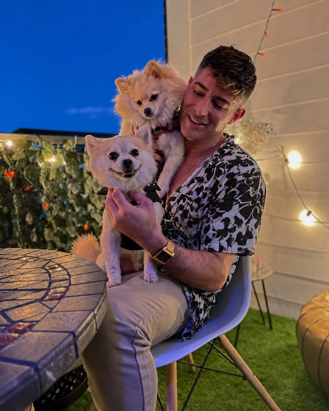 Erez, the stylist behind The Hair Magician, with his two Pomeranians
