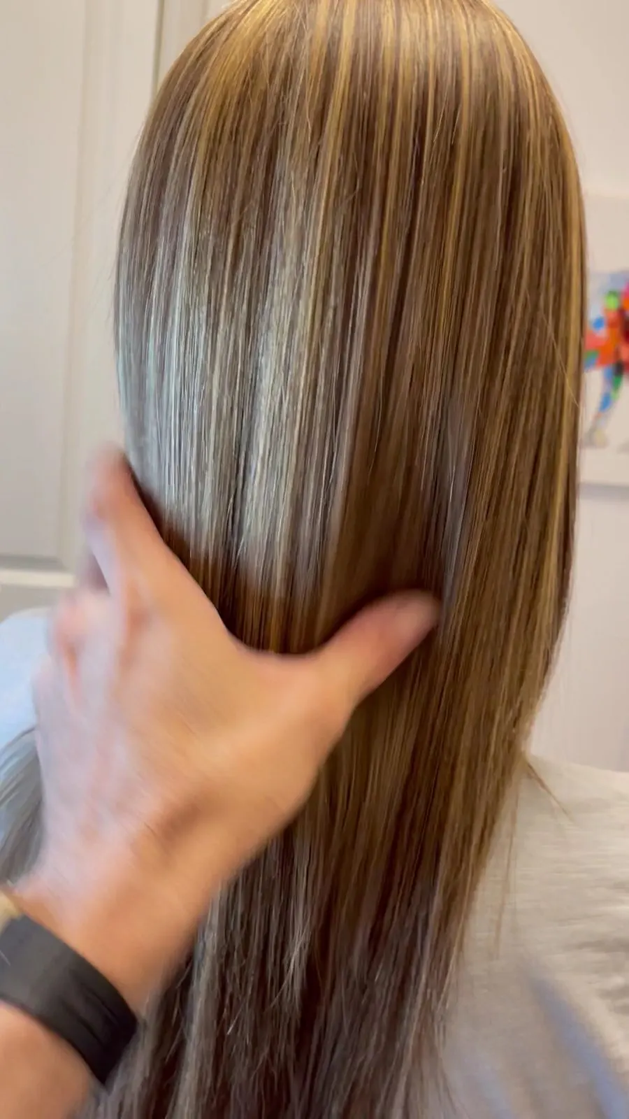 Sleek, straightened blonde hair after a smoothing service